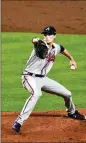  ?? ATLANTA JOURNALCON­STITUTION ?? Braves pitcher Max Fried delivers in the first inning on his way to six scoreless in Tuesday’s Game 6 clincher.