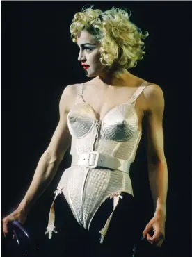  ?? ?? ‘Her cone bra was weapon-like’ … Madonna in concert in 1990, wearing her iconic Jean Paul Gaultier attire. Photograph: Gie Knaeps/Getty Images