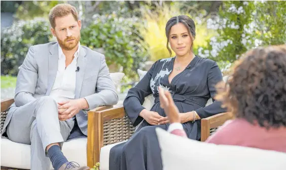 ?? Photo / AP ?? Prince Harry, left, and Meghan, Duchess of Sussex, in conversati­on with Oprah Winfrey.