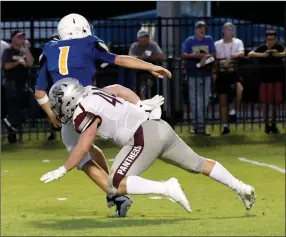  ?? Bud Sullins/Special to the Herald-Leader ?? Siloam Springs senior Matt Avery tackles Pryor (Okla.) quarterbac­k Trapper Gilstrap during the Panthers’ 38-21 season-opening win on Aug. 31 in Pryor.