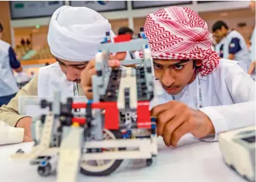  ?? File photos ?? Students showcase their skills during the National Robot Olympiad in Abu Dhabi; students of Indian High School, Oud Metha during a class; A teacher leading an Arabic class for primary students at the Dubai British School. —