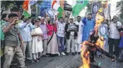  ?? —PTI ?? Congress workers burn an effigy of Prime Minister Narendra Modi during a protest in Wayanad, Kerala