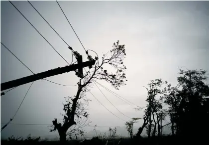  ?? Picture / AP ?? Power lines felled by Hurricane Maria in Puerto Rico. Extreme weather took a big toll on the US last year.