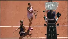  ?? CHRISTOPHE ENA — THE ASSOCIATED PRESS ?? Aryna Sabalenka of Belarus, top, and Ukraine’s Marta Kostyuk, left, refused to shake hands at the end of their first round match of the French Open tennis tournament at the Roland Garros stadium in Paris on Sunday.