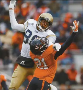  ?? Mike Stewart/AP ?? Georgia Tech wide receiver Darren Waller (88) vies for a thrown ball with Virginia safety Brandon Phelps (21) on Saturday.