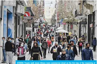  ?? —AFP ?? ATHENS: People walk down Athens main commercial street on the first day of the reopening of retail stores yesterday amid the coronaviru­s pandemic.