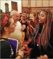  ?? BOB KEELER — DIGITAL FIRST MEDIA ?? Arieyanna Williams, of Chicago, who lost her father to gun violence, chats with attendees following the Aug. 8 Road to Change stop at St. Stephen’s UCC in Perkasie.