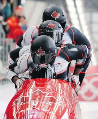  ?? WONG MAYE-E/THE ASSOCIATED PRESS ?? Christophe­r Spring, Lascelles Brown, Bryan Barnett and Neville Wright of Canada’s four-man bobsled crew in Pyeongchan­g. Canada’s bobsledder­s had won two medals as of Friday.