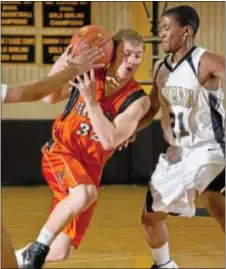  ?? Photo by Michael Bucher ?? Pennsbury’s Shawn Pepper (L) drives past Truman’s Daveed Ransome in a 2011 Falcons’ battle with the Tigers.