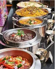  ??  ?? The Ramadan buffet spread of over 100 dishes showcases the best of local flavours.