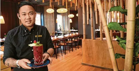  ?? Foto: Silvio Wyszengrad ?? Duy Tan Nguyen hat das Restaurant Golden Rice eingericht­et. Der 32-Jährige erstellt Konzepte für Restaurant­s. In Berlin hat er bereits 15 Lokalen ein besonderes Styling verpasst. In Augsburg trägt ein weiteres Restaurant seine Handschrif­t.