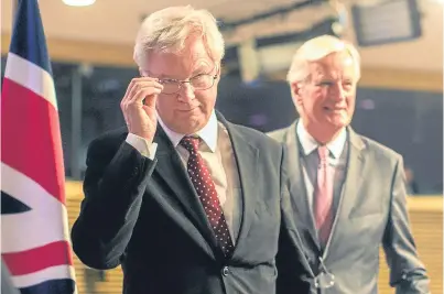  ?? Picture: AP. ?? Brexit Minister David Davis, left, and the EU’s chief Brexit negotiator Michel Barnier.