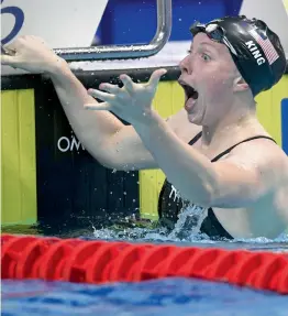  ??  ?? USA’s Lilly King reacts after winning the women’s 100m breaststro­ke final in a world record time of one minute and 4.13 seconds, overhaulin­g the mark set by Lithuania’s Ruta Meilutyte in 2013. —