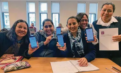  ?? Religion News Service courtesy photos ?? A group of nuns pose with their phones during a 2020 training session for an app developed by Catholic Extension, a nonprofit.