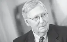  ?? BRENDAN SMIALOWSKI, AFP/GETTY IMAGES ?? “The Intelligen­ce Committee ... can look into whatever they choose to,” Senate Majority Leader Mitch McConnell says.