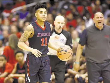  ?? Jerry Baker photos / For the Chronicle ?? Atascocita senior guard Greg Shead works the ball against Desoto during the first quarter of their Class 6A boys basketball state championsh­ip game at the Alamodome in San Antonio last weekend.