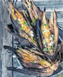  ?? UNSPLASH ?? Corn grilled in its own husks provides a satisfying­ly smoky version of barbecue season’s classic vegetable.