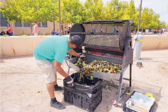  ?? COURTESY OF BERNALILLO COUNTY ?? A Bosque Chile Festival participan­t roasts chile at last year’s event.