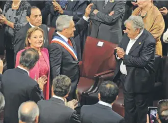  ?? / AP ?? José Mujica y Sebastián Piñera durante el cambio de mando en marzo de 2014.