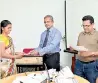  ??  ?? Handing over a certificat­e to a participan­t by Chinthaka S. Lokuhetti, Secretary Southern Province Sports Ministry