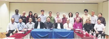  ??  ?? (Seated from fourth left) Ambrose, Ng, Ngenang, Justin and Cheong pose for a photo-call with other religious leaders in Miri after the meeting. Tiong is at fifth right (back row).