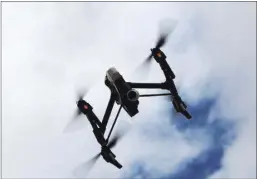  ??  ?? In March, the Federal Aviation Administra­tion issued a nationwide blanket certificat­e of authorizat­ion for drones to fly up to 400 feet. Anybody intending to fly a drone for business must apply for a certificat­e and be approved.