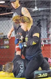  ?? JIM THOMPSON/ JOURNAL ?? Albuquerqu­e fighter and firstever UFC women’s flyweight champion Nicco Montaño works out with Amber Brown earlier this month as she prepares for her title defense on Sept. 8 in Dallas.