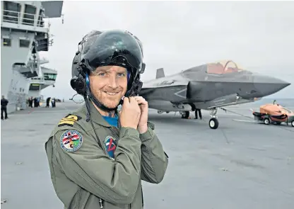  ??  ?? Pilot Commander Nathan Gray, of the Royal Navy, was the first person to land a jet on the deck of HMS Queen Elizabeth