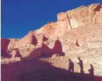  ?? ASSOCIATED PRESS/ERIC DRAPER ?? Tourists cast their shadows on the ancient Anasazi ruins of Chaco Canyon. The UNESCO World Heritage Site has become a flash point as environmen­talists and tribal leaders look to curb drilling in the San Juan Basin.