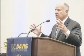  ?? KARIN HIGGINS — UC DAVIS ?? Gov. Jerry Brown, speaking at UC Davis on Friday, said climate change threatens to make huge fires and mudslides more commonplac­e in the state.