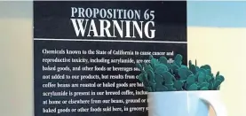  ?? DAMIAN DOVARGANES/AP ?? This photo from last year shows a Propositio­n 65 warning sign at a Starbucks in Burbank, Calif.