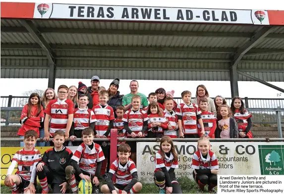  ?? ?? Arwel Davies’s family and Llandovery Juniors are pictured in front of the new terrace. Picture: Riley Sports Photograph­y