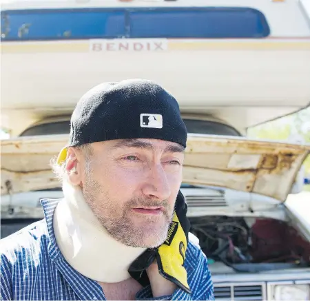  ?? GERRY KAHRMANN/PNG ?? Sean Murphy stands in front of his broken motorhome near the Renfrew SkyTrain station in East Vancouver. Murphy and his wife Brenda are living in the motorhome.