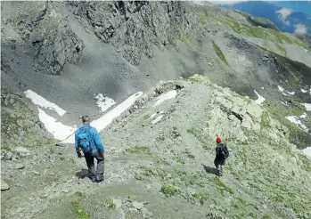  ?? Picture: Fiona McIntosh ?? DOWNSCALIN­G The adventurer­s descend from the Col de Traversett­e.