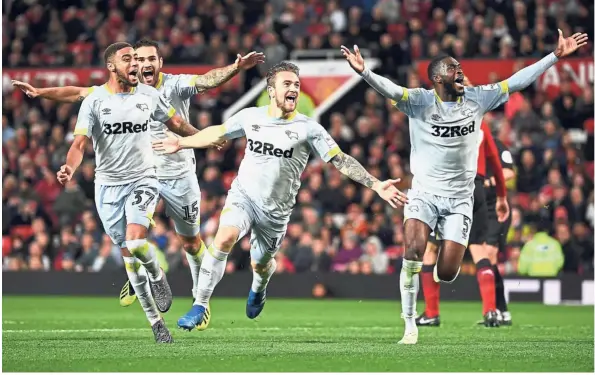  ??  ?? Amazing feat: Derby County striker Jack Marriott (centre) celebratin­g with teammates after scoring the second goal against Manchester United during the League Cup third-round match at Old Trafford on Tuesday. — AFP