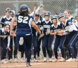  ?? Signal file photo ?? West Ranch softball’s Alyssa Jauregui is greeted by her teammates as she approaches home plate after hitting a home run against Warren in the CIF-Southern Section Division 3 quarterfin­als at Warren High School in May 2019. Softball is among the high school sports given the OK by CIF officials to participat­e in section championsh­ips this spring.