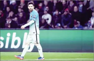  ?? LIONEL BONAVENTUR­E/AFP ?? Barcelona forward Lionel Messi looks on during the UEFA Champions League round of 16 first leg match against Paris Saint-Germain on February 14.