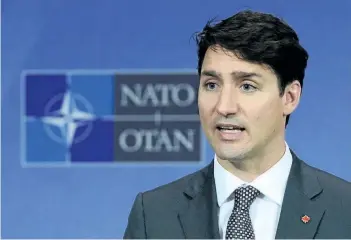  ?? SEAN KILPATRICK/THE CANADIAN PRESS ?? Prime Minister Justin Trudeau holds a press conference at NATO headquarte­rs during the NATO Summit in Brussels, Belgium on Thursday.