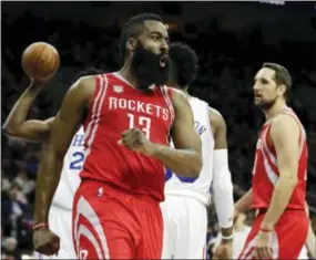  ?? MATT SLOCUM — THE ASSOCIATED PRESS ?? Houston Rockets guard James Harden reacts after being fouled during the second half against the Sixers on Friday.