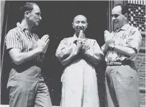  ?? DOUGLAS & MCINTYRE ?? Pierre Trudeau, left, and his close friend Jacques Hébert salute a monk during a visit to China in 1960.