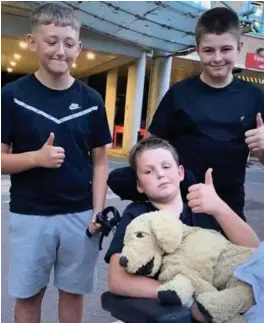  ??  ?? Cain Griffiths, centre, with his brother Cullun and cousin Gethin Griffiths at Bristol Children’s Hospital