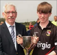  ??  ?? Kyle Rankin is presented with the trophy by Ian Lawlor.