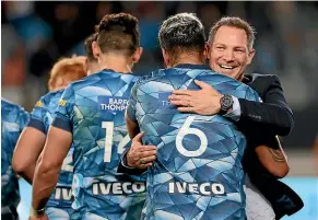  ?? GETTY IMAGES ?? Blues coach Leon MacDonald celebrates victory with his team after their triumph over the Highlander­s on Saturday.