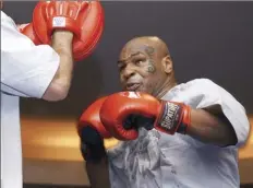  ?? AP file photo ?? Mike Tyson spars during a training exhibition in Las Vegas on Aug. 30, 2006.