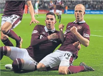  ?? Picture: SNS. ?? Hearts goalscorer­s Kyle Lafferty, left, and Steven Naismith show their delight after Naismith made it 2-1 to the Tynecastle men.