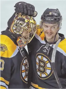  ?? STAFF PHOTO BY MATT STONE ?? ON A ROLL: Defenseman Colin Miller congratula­tes goalie Tuukka Rask after the B’s win against the Blue Jackets last Thursday.