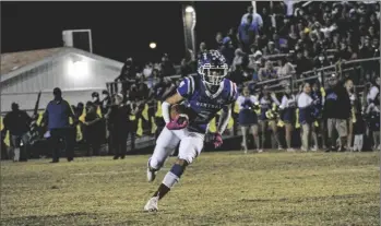  ?? PHOTO CORISSA IBARRA ?? Central Union sophomore Arturo Estrada carries the ball in Friday night’s Bell Game against Brawley Union High School.