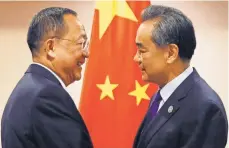  ?? BULLIT MARQUEZ, AP ?? North Korean Foreign Minister Ri Yong Ho, left, is greeted by his Chinese counterpar­t, Wang Yi, Sunday in Manila.