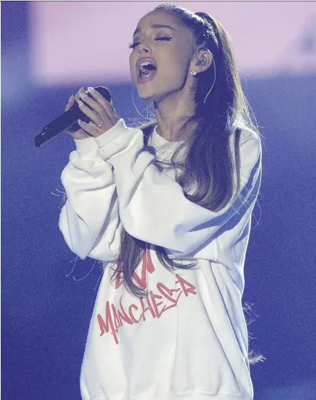  ?? DAVE HOGAN/GETTY IMAGES/FOR ONE LOVE MANCHESTER ?? Ariana Grande performed Over the Rainbow on Sunday to close out her tribute show in Manchester, England, following a May 22 suicide bombing during her previous show in that city. The song often turns up as a comfort during moments of tragedy, writes...