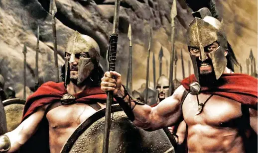  ?? ?? Into battle: Gerard Butler, right, in the hit film 300
